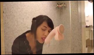 Watch the video about Hot asian uses a dildo in the shower