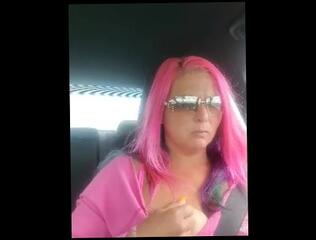 Watch the video about Sukie Rae plays with her tits while driving.