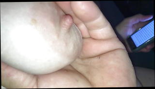 Watch the video about Playing with nipple on her saggy tit.