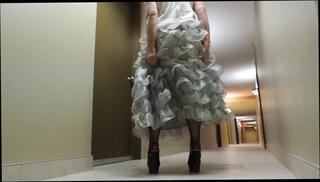 Watch the video about Sissy Ray in Silver Evening dress in hotel corridor