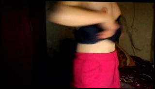 Watch the video about Hacked laptop camera. Girl puts on a bra