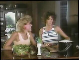 Watch the video about Two horny lesbian sluts in a retro porn video