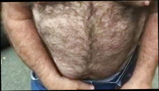 Watch the video about Hairy daddy wank in public