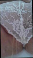 Watch the video about Pissing through her lacy panties