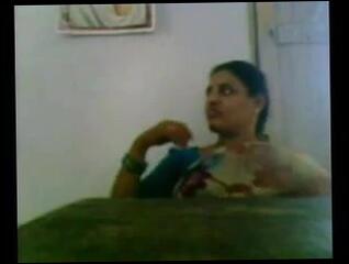 Watch the video about Desi Aunty in Saree Showing Boobs
