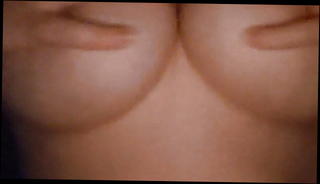 Watch the video about Playing with my huge tits