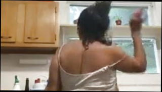 Watch the video about Cockraising Mature Latina Dancing While Doing the dishes
