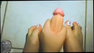 Watch the video about Latina Spits, Strokes And Does Footjob On Dildo