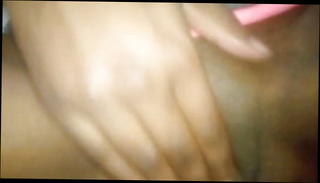 Watch the video about Young slim ebony MILF fingering and slapping her pussy