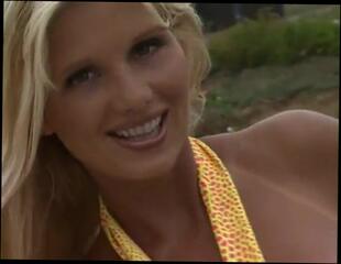 Watch the video about Big-titted milf shows her goods in softcore porn video