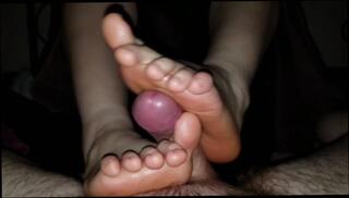 Watch the video about Babe gives me a Footjob