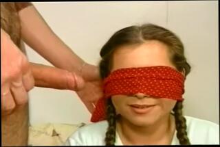 Watch the video about Blindfolded Tart Gobbles A Stiff Wang