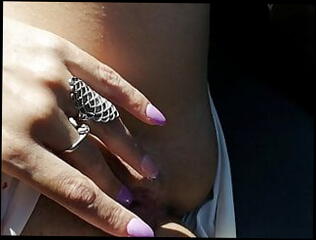 Watch the video about ITALIAN MILF GRETA fingering pussy on highway