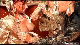 Watch the video about Hot babes with big tits getting covered