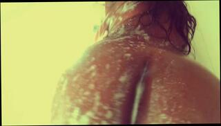 Watch the video about Busty Babe Rubbing Wet Body