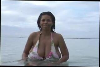 Watch the video about Busty Dominican MILF at the Beach (softcore)