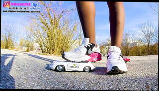 Video 1150037065: girl shoeplay, girl toying, toy car crush, girl trample, giantess toy