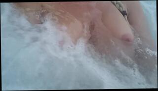 Watch the video about Playing with my boobs in hot tub