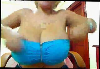 Watch the video about Girl lets out her big tits on cam
