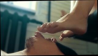 Watch the video about Mistress made slave licks beautiful feet and suck toes with red nails, foot worship domination