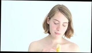 Watch the video about Teasing blonde babe playing with a banana